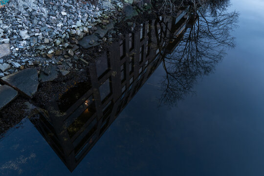Building reflected in river
