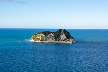 Fototapeta premium Solitary Island in Calm Blue Waters