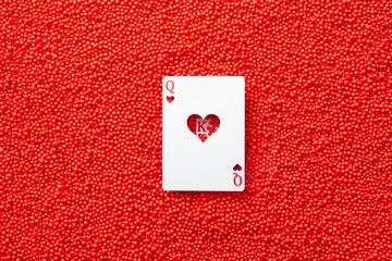 Queen heart card on red textured background