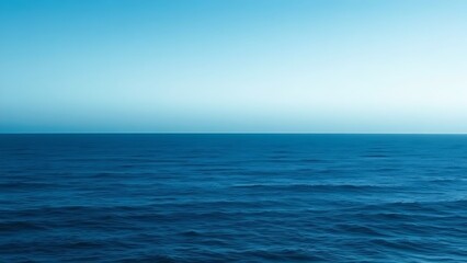 Obraz premium Minimalist coastal horizon with gradient blue tones and soft wave textures, creating atmospheric calm.