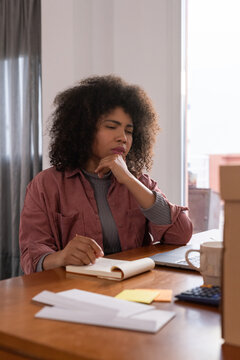 Woman thinking while working