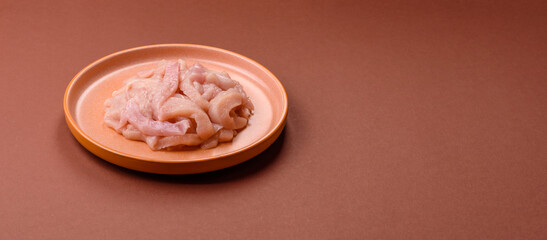 Raw chicken meat cut into strips, fresh fillet or breast slices. Chicken raw meat in pieces