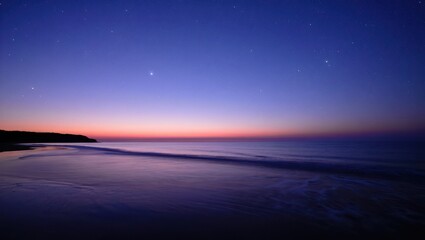 Fototapeta premium Starry night sky over the ocean at sunset with a beautiful horizon view