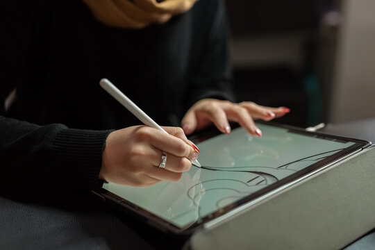 Young Artist Creating Digital Artwork Using a Tablet