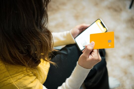 Woman with Credit Card and Smartphone