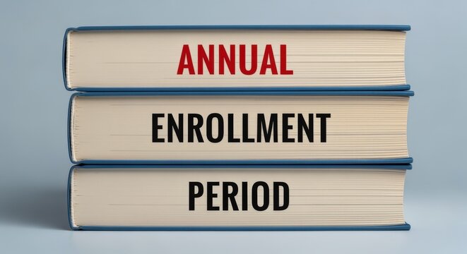 Annual enrollment period shown on three books, representing school, business, or healthcare registration