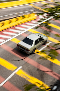 Driver commuting in yellow markings urban road