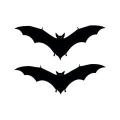 Naklejka premium Two black halloween bats flying in the night sky isolated on white background, spooky creatures
