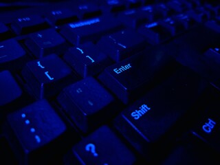 Close-up of a modern computer keyboard with sleek keys, ideal for illustrating digital workspaces, tech setups, and productivity themes. Perfect for business, IT, and e-learning visuals.