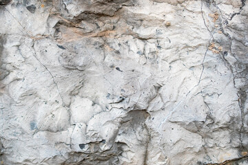 Close-up of weathered rock face with intricate textures and cracks