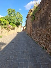street in the old town of montalcino, tuscany