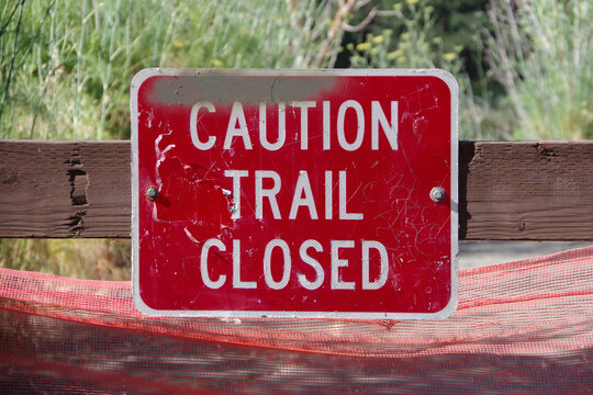 CAUTION TRAIL CLOSED warning sign