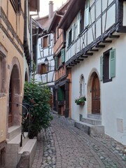 narrow street in the old town of Riquewihr, Alsace, France
