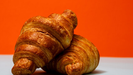 Freshly baked french croissant. Golden croissant for breakfast