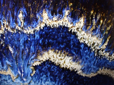 Textured background of microscopic glaze of Chinese ceramics tea cup
