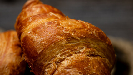 Freshly baked french croissant. Golden croissant for breakfast
