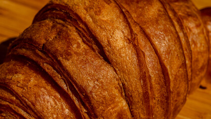 Freshly baked french croissant. Golden croissant for breakfast