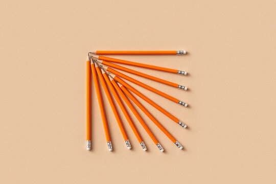 Orange pencils arranged in fan shape