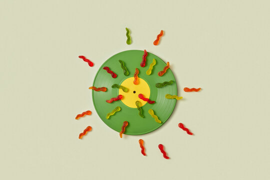 Gummy worms in spiral, evoking fertilization concept