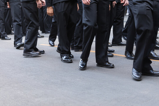 Synchronized March of Black-Clad Individuals