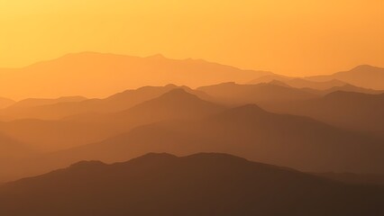 Obraz premium A serene mountain landscape bathed in golden hour light, showcasing nature's grandeur.