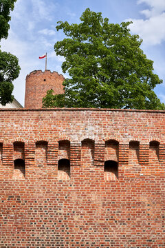 Medieval defensive wall of a historic castle with a tower in Lagow