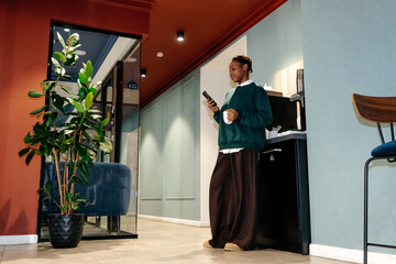 Coffee break in shared office kitchen