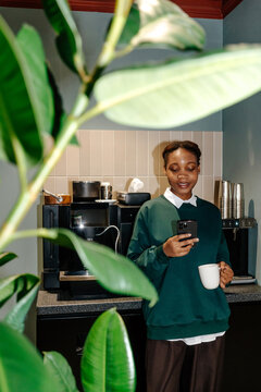 Coffee break with phone in hand