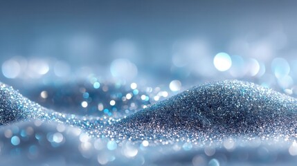 Beautiful blue glitter sparkles, creating a dreamy, elegant and abstract background.
