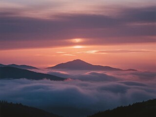 Obraz premium Beautiful Sunrise Over Misty Mountain Range with Pink Sky