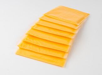 American cheese, processed cheese slice, wrapped thin yellow cheddar in a plastic package