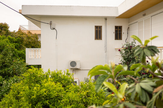 Residential Air Conditioner Unit and Garden View