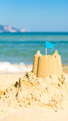 Beach sandcastle with flag