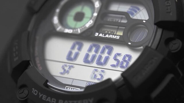 Macro close up of a tactical digital watch face functioning
