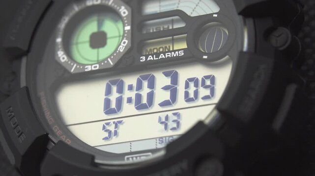 Macro close up of a tactical digital watch face functioning
