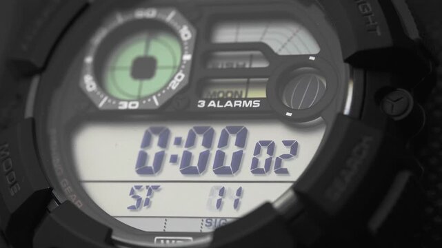 Macro close up of a tactical digital watch face functioning
