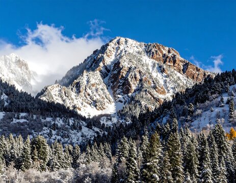 Snowy mountain peak, sunlit, winter landscape