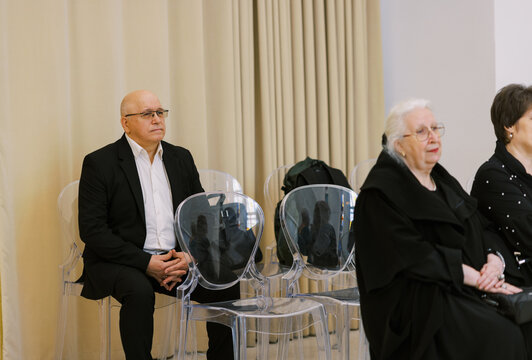 Guests sitting on the wedding ceremony 
