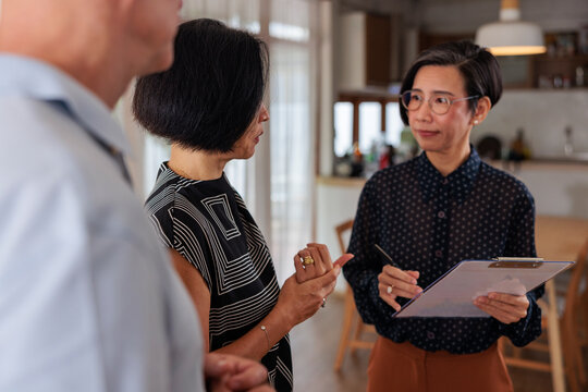 Real estate agent listens to concerns of clients