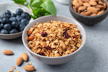 Homemade granola with nuts and dried fruits in a bowl. Healthy snack