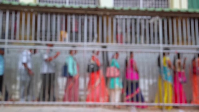 Bokeh view of devotees visit Sri Chamundeshwari Temple, located on Chamundi Hills near Mysore, India. Blurred background footage.