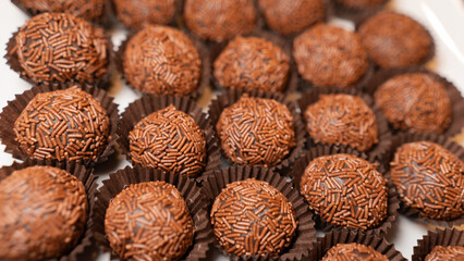 Traditional Brazilian brigadeiro chocolate truffles in elegant presentation. Perfect for dessert tables, party favors, and gourmet food photography with rich cocoa flavor