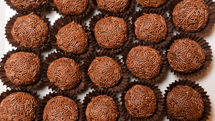 Traditional Brazilian brigadeiro chocolate truffles in elegant presentation. Perfect for dessert tables, party favors, and gourmet food photography with rich cocoa flavor
