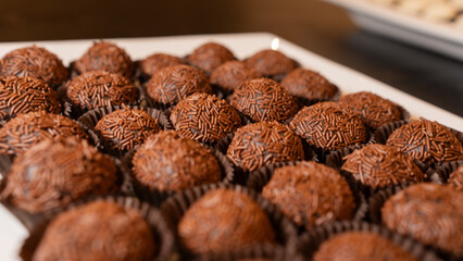 Traditional Brazilian brigadeiro chocolate truffles in elegant presentation. Perfect for dessert tables, party favors, and gourmet food photography with rich cocoa flavor