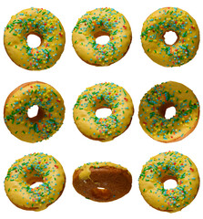 Yellow glazed donuts, each decorated with multi colored sprinkles.
