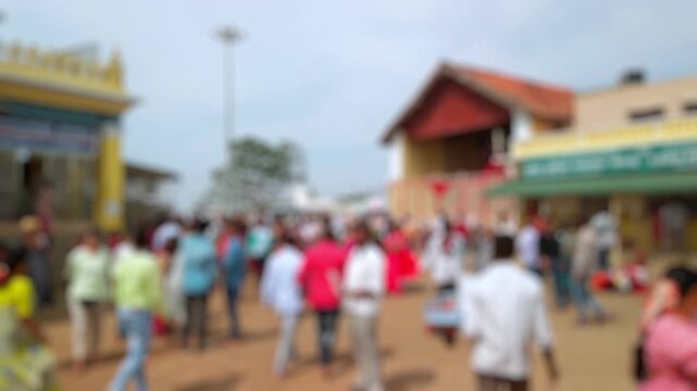 Bokeh view of devotees visit Sri Chamundeshwari Temple, located on Chamundi Hills near Mysore, India. Blurred background footage.