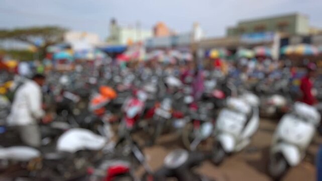 Bokeh view of devotees visit Sri Chamundeshwari Temple, located on Chamundi Hills near Mysore, India. Blurred background footage.