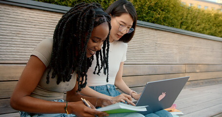University students working on project  with laptop