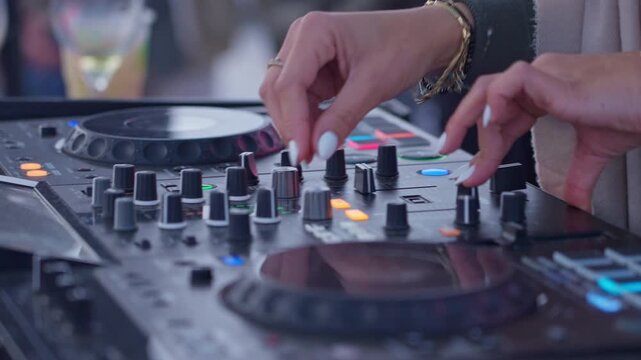 Female dj scratching vinyl with colorful bokeh
