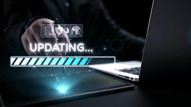 A hand interacts with a tablet while software updates on a laptop. The scene includes an overlay of icons and a progress bar, reflecting modern technology and connectivity. Qubit